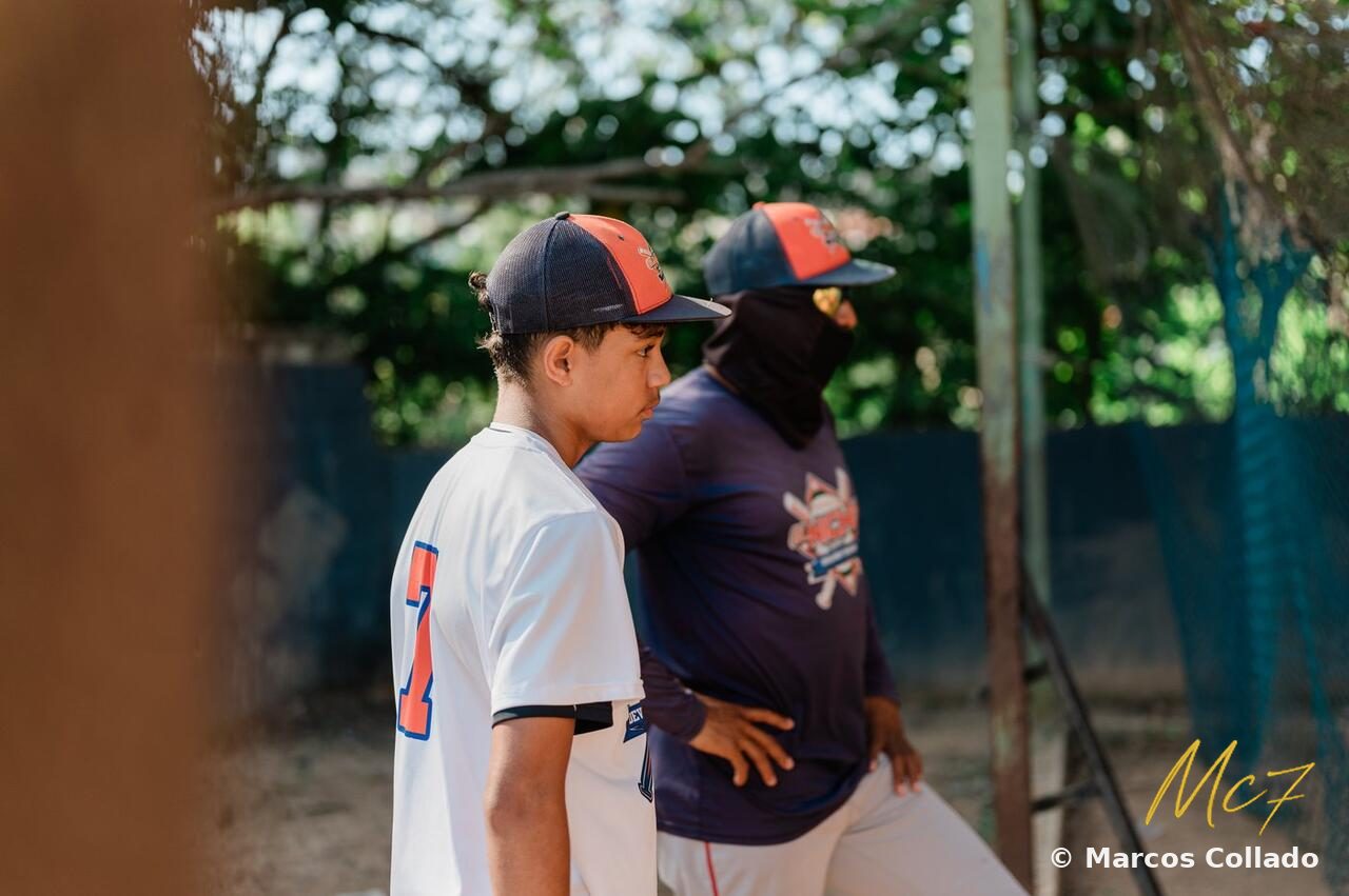 Marcos Collado with his coach at El Niche Baseball Academy