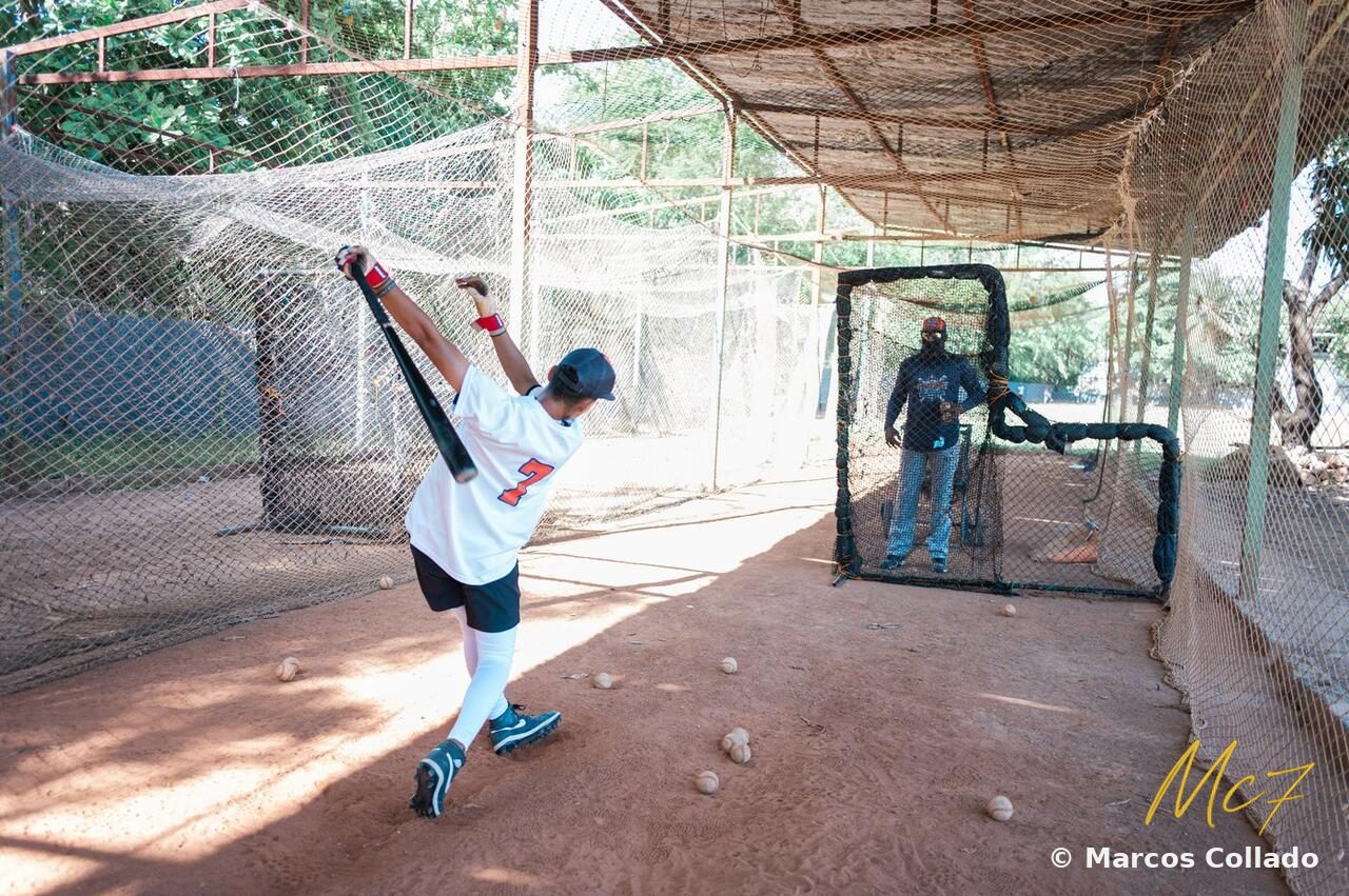 Marcos Collado following through on a swing in the batting cage