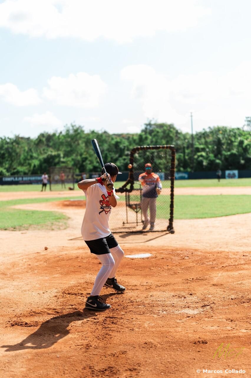 Marcos Collado in batting stance facing a pitching screen