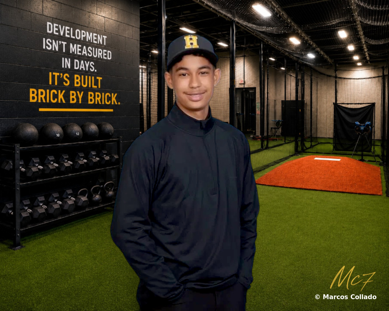 Marcos Collado in the training facility, with the Brick by Brick quote on the wall